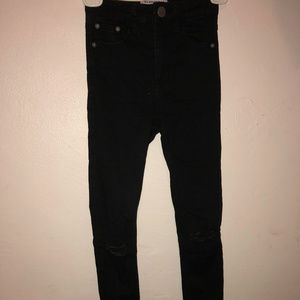 High-waisted ripped black jeans